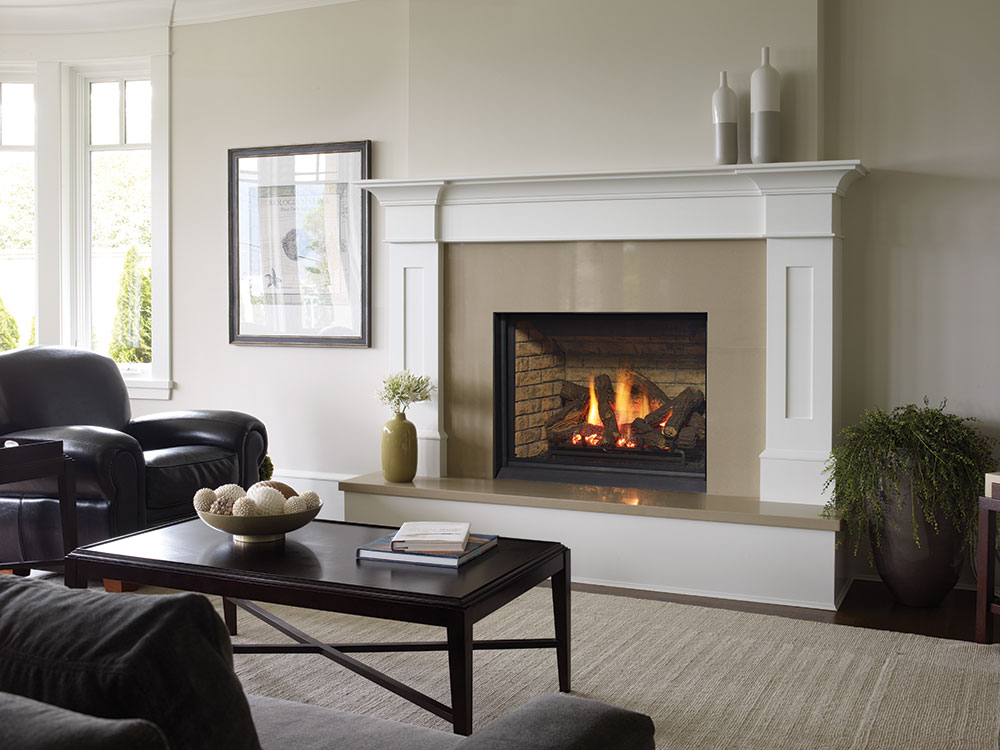 Gas insert stove with the flame lite and in a living room setting.